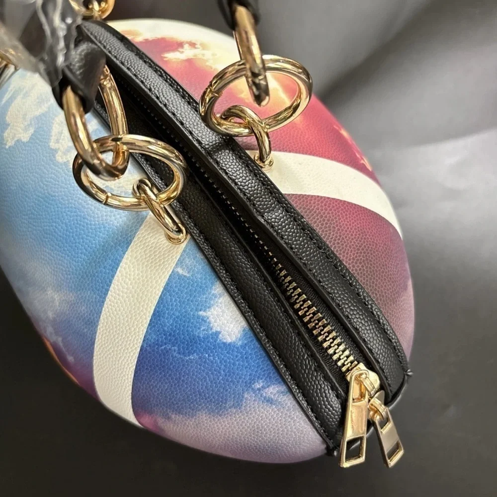NWT-whimsical tie-dyed clouds  Pristine pebbled Rugby football purse gold chain